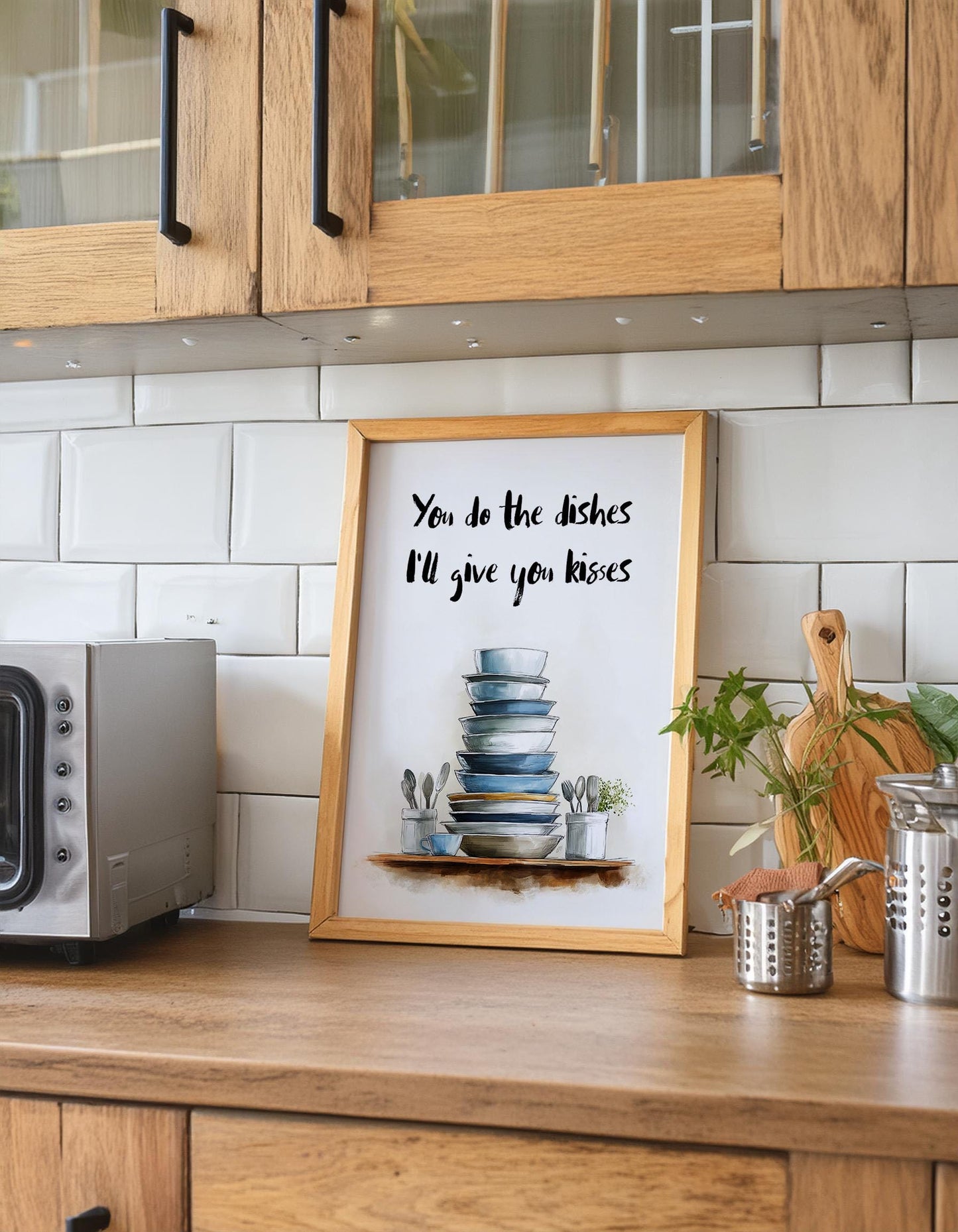 Charming kitchen wall art featuring a stack of blue and white dishes with the handwritten quote “You do the dishes, I’ll give you kisses.” Romantic and funny home décor print ideal for kitchens or dining rooms. Perfect gift for couples who love playful, modern artwork. Professionally printed to order on premium satin photo paper by Hues & Reflections UK.