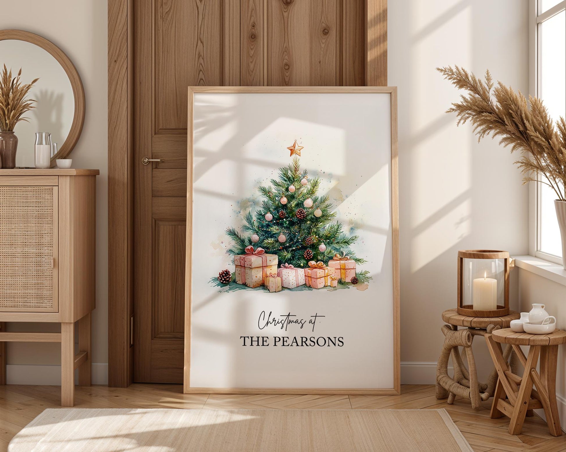 Watercolour Christmas tree decorated with gold star, pinecones, and pink baubles surrounded by wrapped gifts in soft festive tones. Customisable family name text reads “Christmas at The Jacksons.” Elegant personalised holiday wall art perfect for festive home décor or a thoughtful family Christmas gift. Printed to order on premium satin paper by Hues & Reflections UK.
