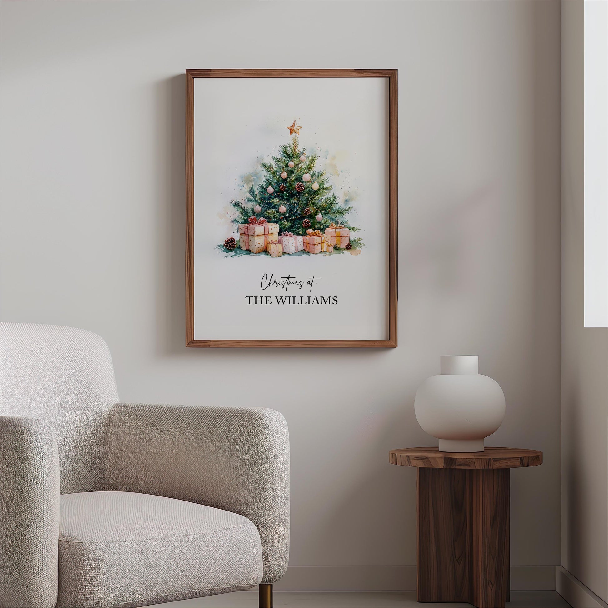 Watercolour Christmas tree decorated with gold star, pinecones, and pink baubles surrounded by wrapped gifts in soft festive tones. Customisable family name text reads “Christmas at The Jacksons.” Elegant personalised holiday wall art perfect for festive home décor or a thoughtful family Christmas gift. Printed to order on premium satin paper by Hues & Reflections UK.