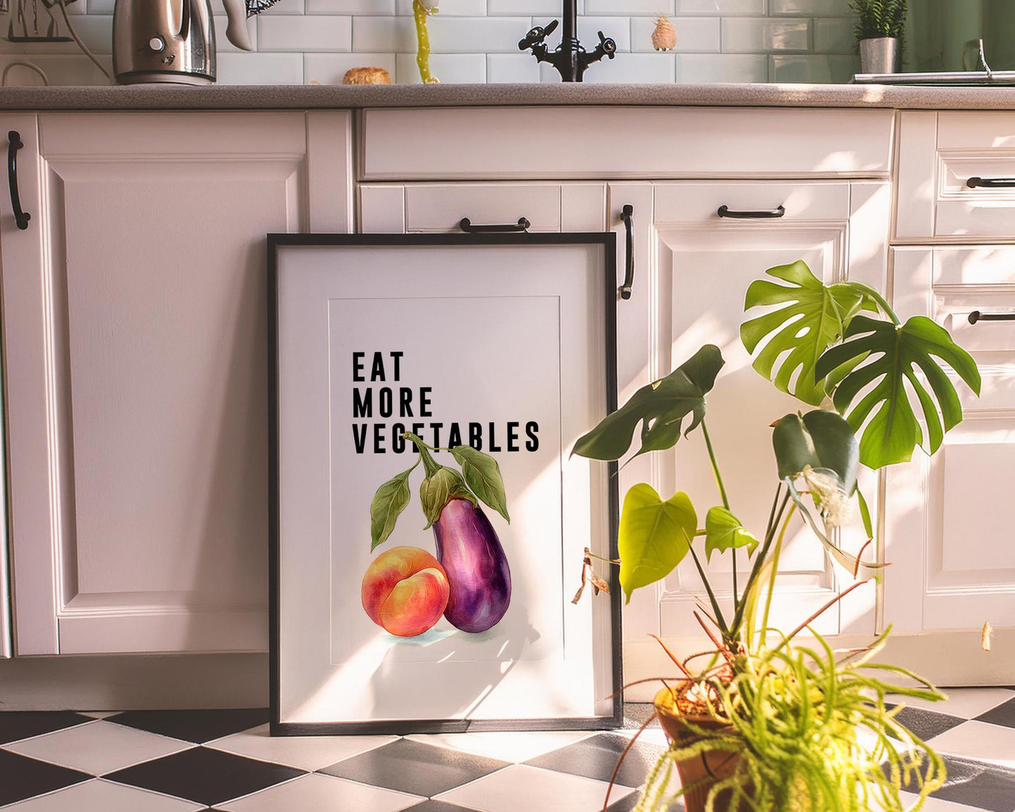 Playful food-themed wall art featuring bold black typography reading “Eat More Vegetable” above a colourful illustration of an aubergine and peach. Modern humorous kitchen poster with a cheeky twist, perfect for kitchens, dining rooms, or as a fun gift for friends. Printed to order on premium satin photo paper by Hues & Reflections UK.