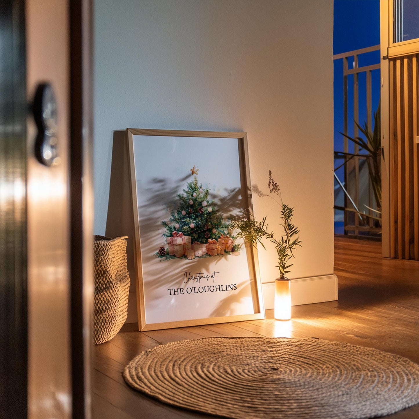 Watercolour Christmas tree decorated with gold star, pinecones, and pink baubles surrounded by wrapped gifts in soft festive tones. Customisable family name text reads “Christmas at The Jacksons.” Elegant personalised holiday wall art perfect for festive home décor or a thoughtful family Christmas gift. Printed to order on premium satin paper by Hues & Reflections UK.