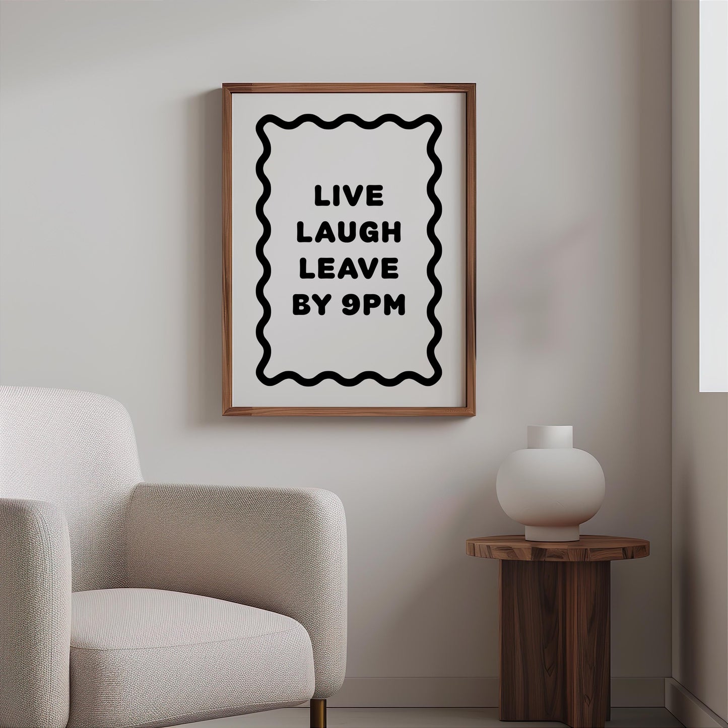 Bold black and white typography poster featuring the phrase “Live Laugh Leave By 9pm” framed by a wavy border. Minimalist modern design perfect for living rooms, hallways, or home offices. Funny quote wall art ideal for introverts, humour lovers, or as a witty gift for friends. Printed on premium satin paper, made in the UK by Hues & Reflections.