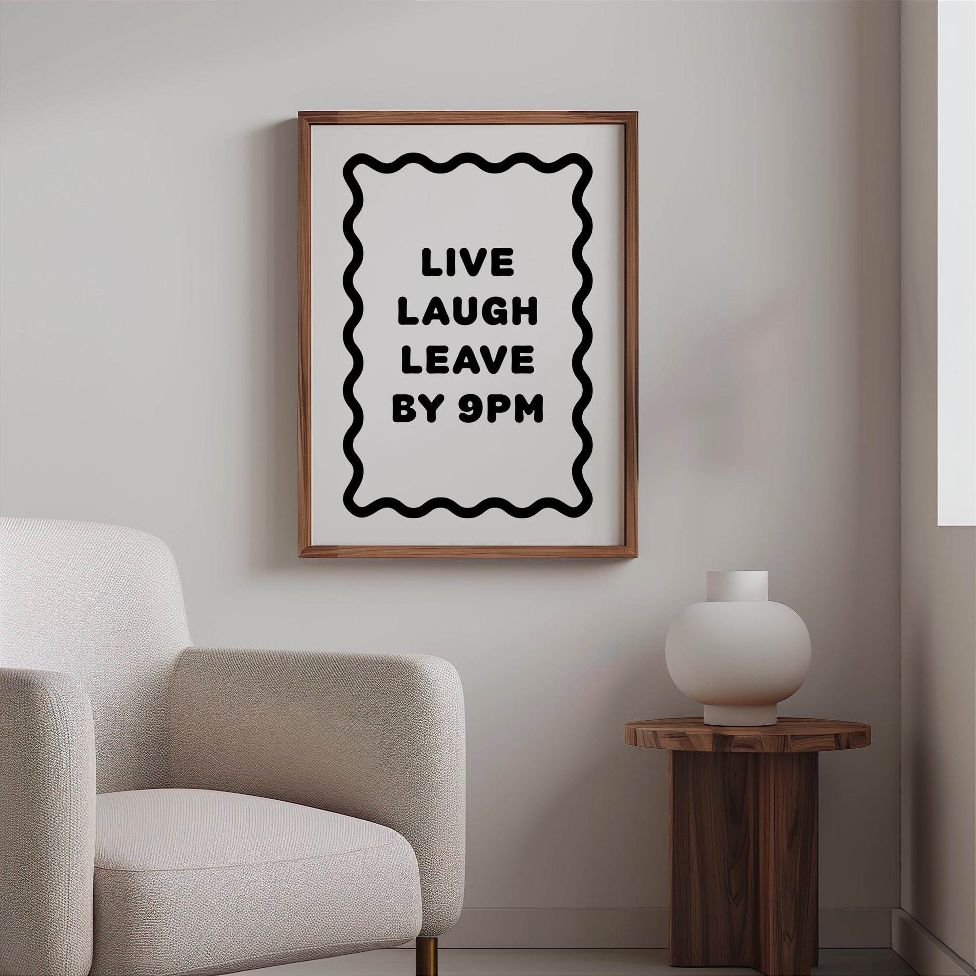Bold black and white typography poster featuring the phrase “Live Laugh Leave By 9pm” framed by a wavy border. Minimalist modern design perfect for living rooms, hallways, or home offices. Funny quote wall art ideal for introverts, humour lovers, or as a witty gift for friends. Printed on premium satin paper, made in the UK by Hues & Reflections.