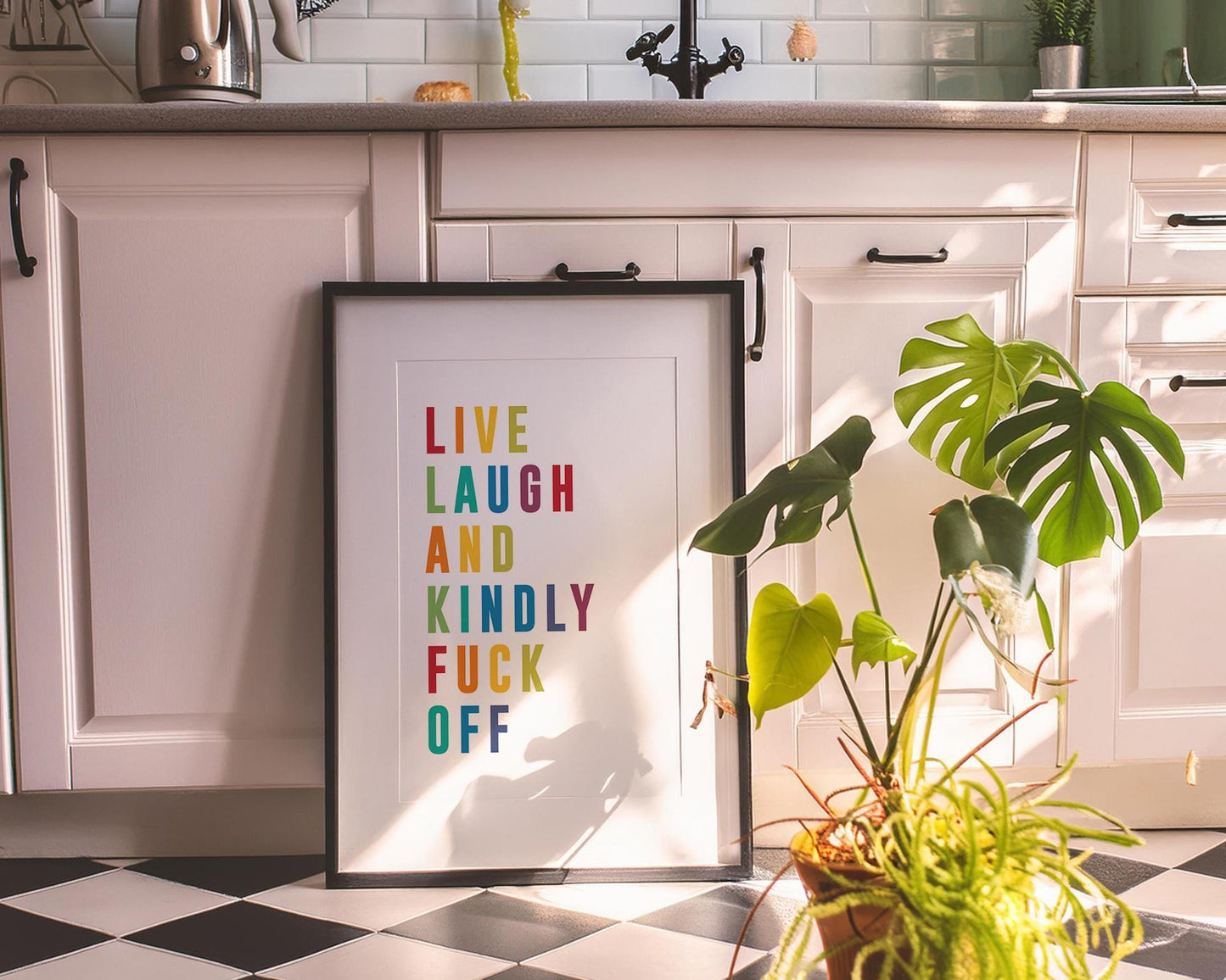 Colourful modern typography poster with the phrase “Live Laugh and Kindly F*** Off” in bold rainbow letters on a white background. Bright, funny quote wall art perfect for bedrooms, living rooms, or offices. A cheeky, contemporary gift for friends with a sense of humour. Printed to order on premium satin photo paper by Hues & Reflections UK.