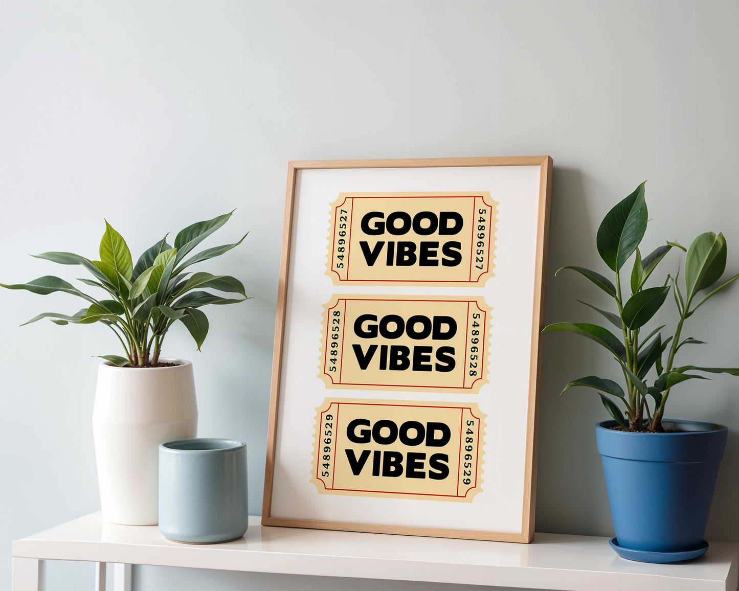 Retro-style typography poster featuring three vintage beige tickets stacked vertically, each with bold black text reading “Good Vibes.” Fun, positive wall art inspired by nostalgic ticket designs. Perfect for uplifting home décor, offices, or as a cheerful gift. Professionally printed to order on premium satin photo paper by Hues & Reflections UK.
