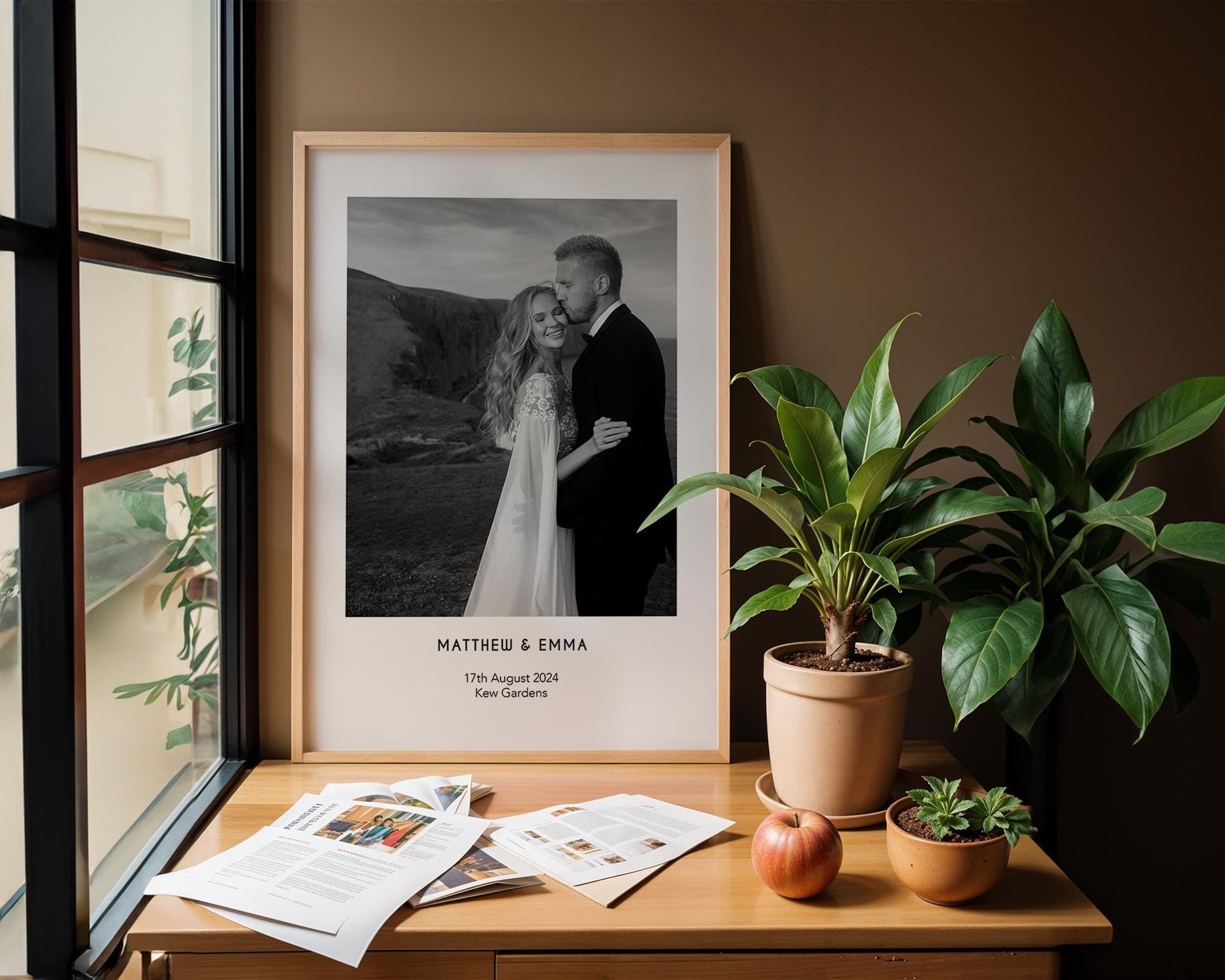 A personalised wedding photo print featuring a couple on their wedding day in elegant natural light. The bride wears an off-shoulder white gown and holds a soft green and white bouquet while the groom embraces her. Minimal modern layout with names, wedding date and venue below the image. A stylish custom keepsake for couples, weddings, anniversaries or home decor.