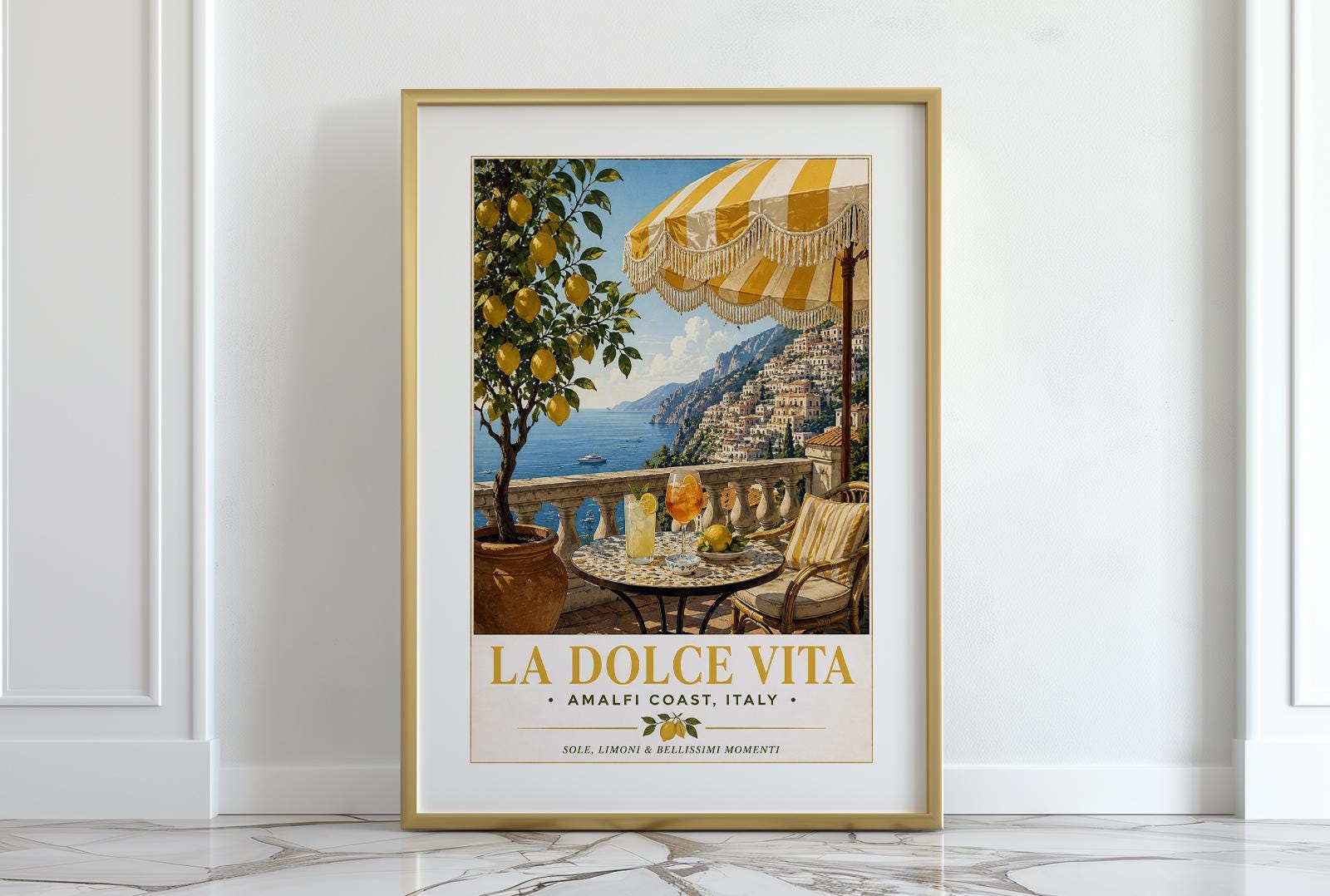 La Dolce Vita vintage travel poster of the Amalfi Coast featuring a Positano terrace with fringed yellow striped umbrella, terrazzo bistro table with Aperol spritz and limoncello, lemon tree in terracotta pot and sweeping view of the Italian coastline, classic Italian railway poster style wall art with golden typography, perfect Mediterranean print for kitchens dining rooms and Italy lovers, printed on premium 260gsm satin lustre paper, handmade in the UK by Hues and Reflections small business