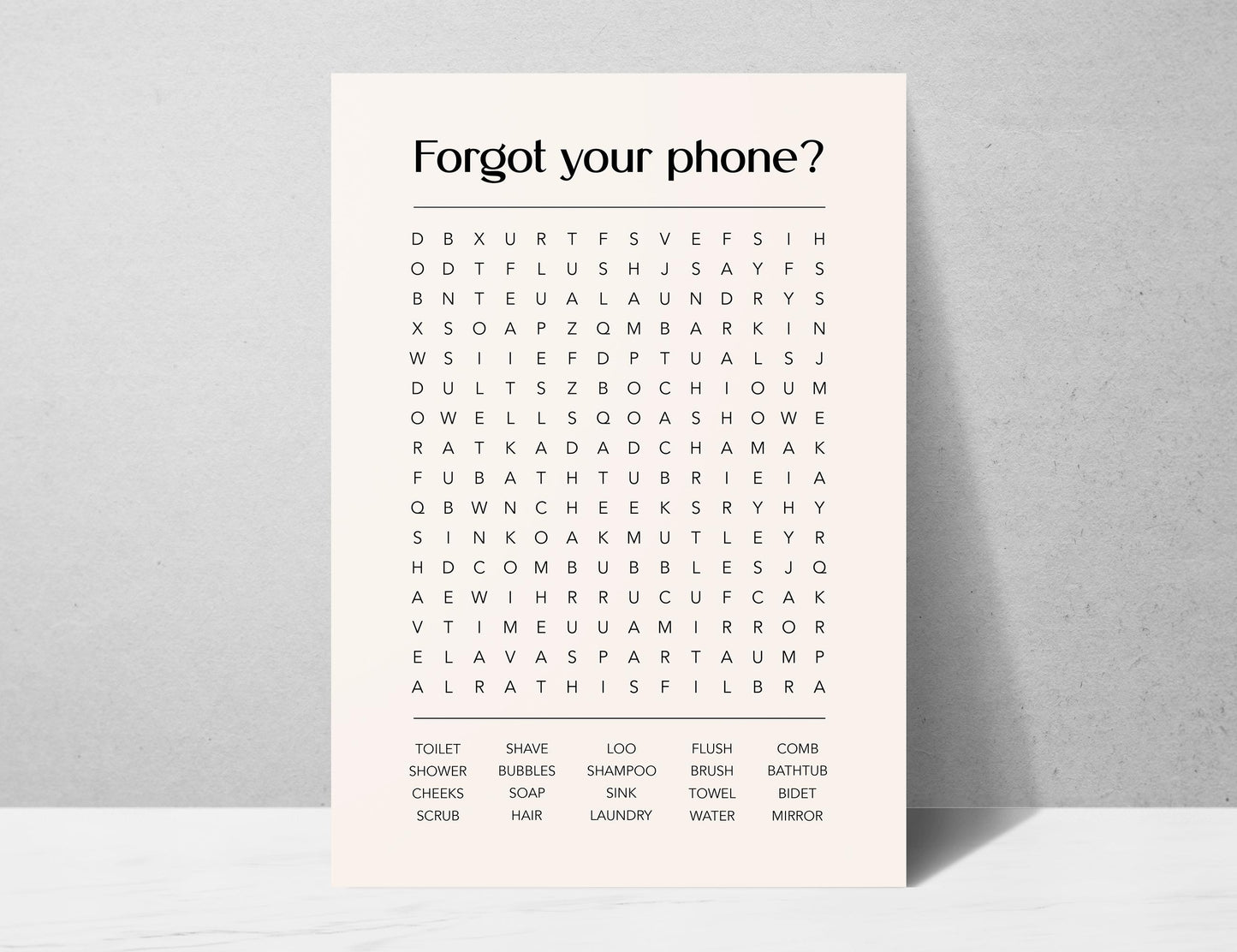 Funny bathroom word search print with the title Forgot Your Phone, modern typographic puzzle wall art featuring hidden bathroom themed words including shower bubbles bidet flush and comb, quirky toilet humour poster available in 8 colours including beige black and white blonde claret forest indigo lobster and olive, perfect for guest bathrooms powder rooms and as a housewarming gift, printed on premium 260gsm satin lustre paper, handmade in the UK by Hues and Reflections small business