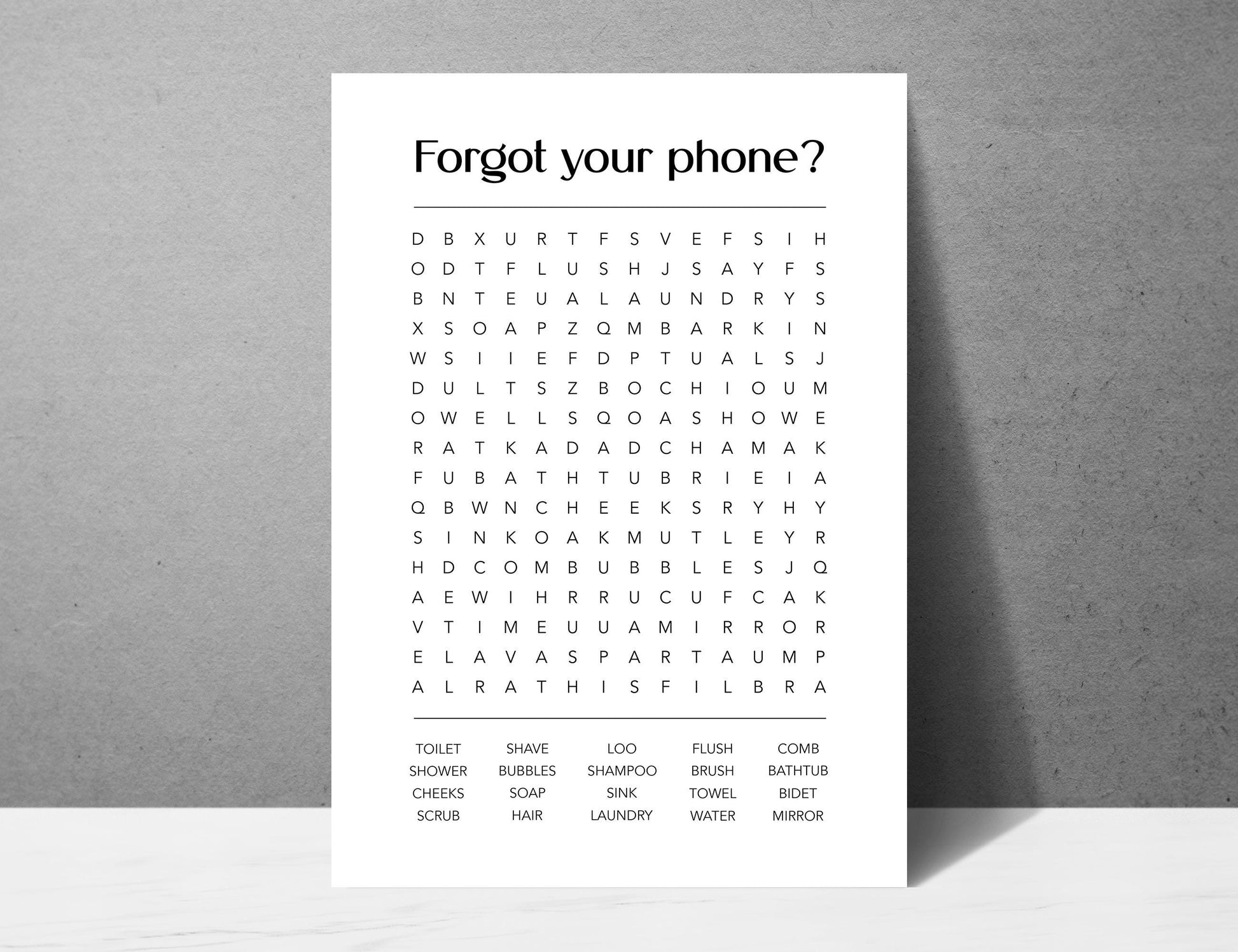 Funny bathroom word search print with the title Forgot Your Phone, modern typographic puzzle wall art featuring hidden bathroom themed words including shower bubbles bidet flush and comb, quirky toilet humour poster available in 8 colours including beige black and white blonde claret forest indigo lobster and olive, perfect for guest bathrooms powder rooms and as a housewarming gift, printed on premium 260gsm satin lustre paper, handmade in the UK by Hues and Reflections small business