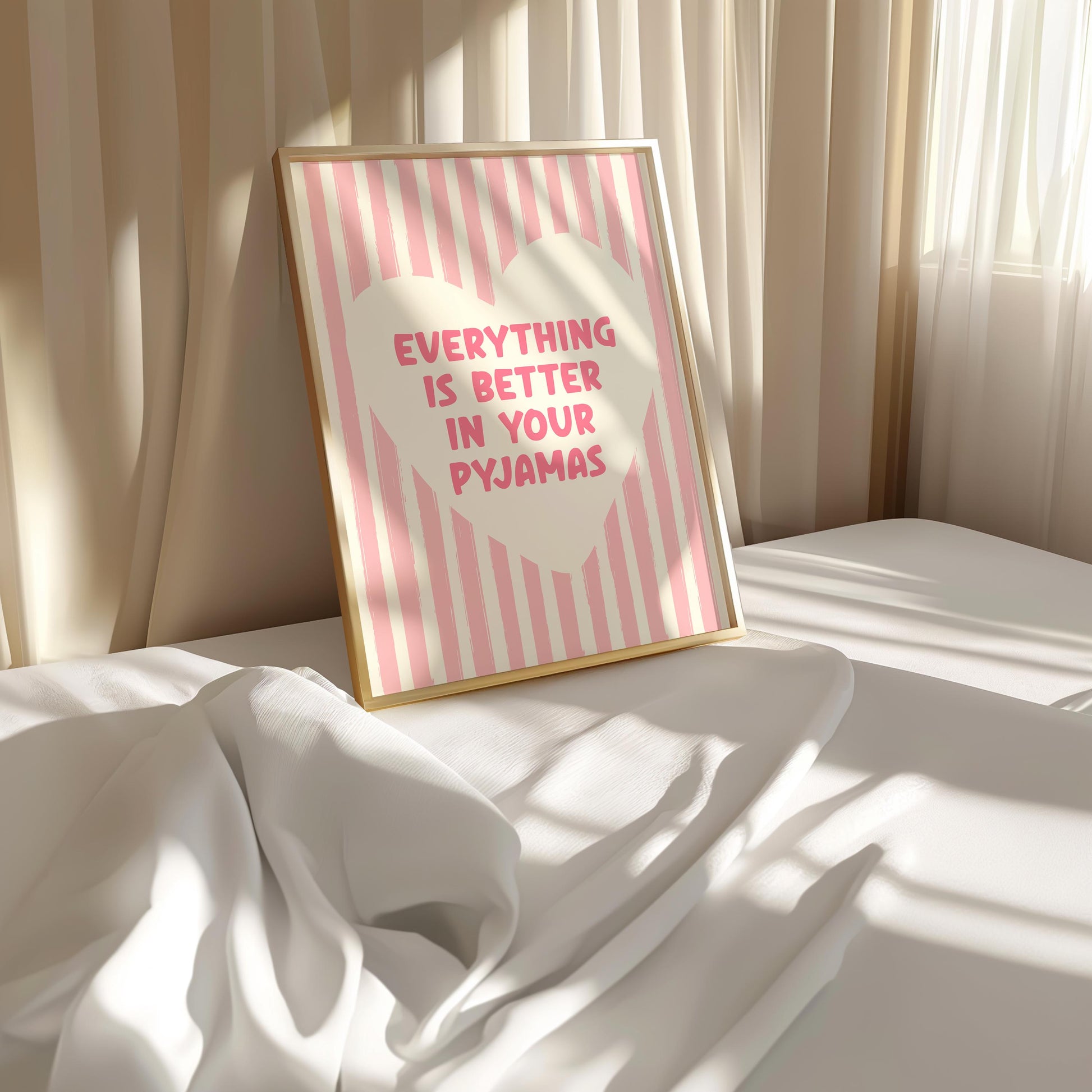 Everything Is Better In Your Pyjamas print, funny pink bedroom wall art featuring a chunky hand drawn quote inside a cream heart on a pink hand painted stripe background, cute cosy bedroom decor poster for above the bed dressing rooms walk in wardrobes and girly interior schemes, perfect thoughtful gift for best friends sisters bridesmaids hen dos Galentines Mother's Day and housewarming, printed on premium 260gsm satin lustre paper, handmade in the UK by Hues and Reflections small business