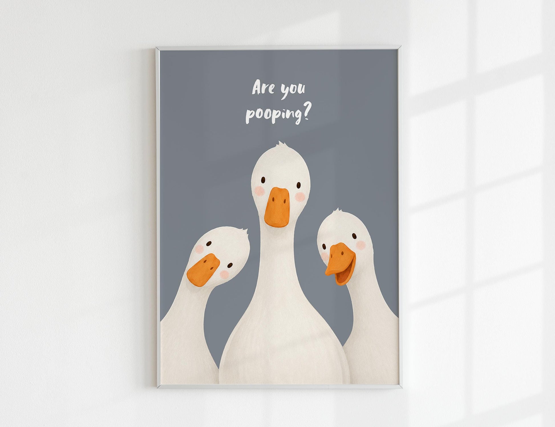 Are You Pooping print, funny bathroom wall art featuring three cute white geese with orange beaks and rosy cheeks on a soft coloured background, whimsical illustrated toilet humour poster also loved as duck art and silly goose art, available in 11 colours including pink jade olive yellow forest green blue sky blonde blue dusk grey claret indigo and white, perfect housewarming gift for powder rooms guest bathrooms and quirky interiors, printed on premium 260gsm satin lustre paper