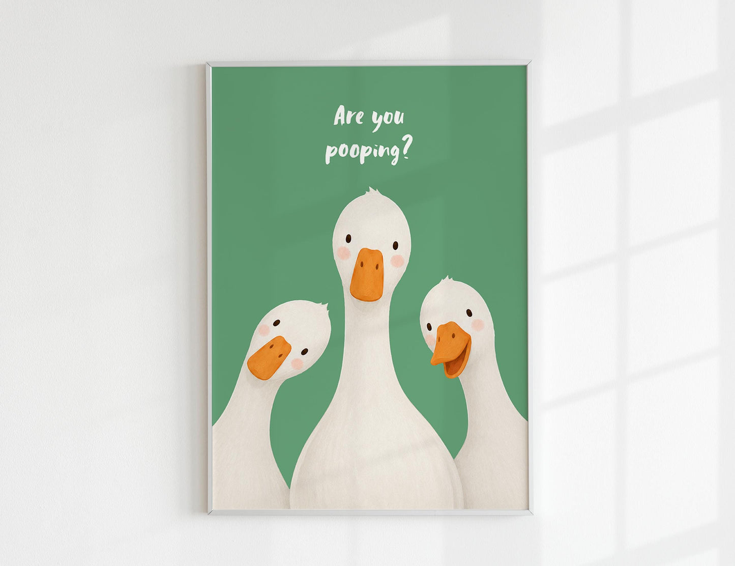 Are You Pooping print, funny bathroom wall art featuring three cute white geese with orange beaks and rosy cheeks on a soft coloured background, whimsical illustrated toilet humour poster also loved as duck art and silly goose art, available in 11 colours including pink jade olive yellow forest green blue sky blonde blue dusk grey claret indigo and white, perfect housewarming gift for powder rooms guest bathrooms and quirky interiors, printed on premium 260gsm satin lustre paper