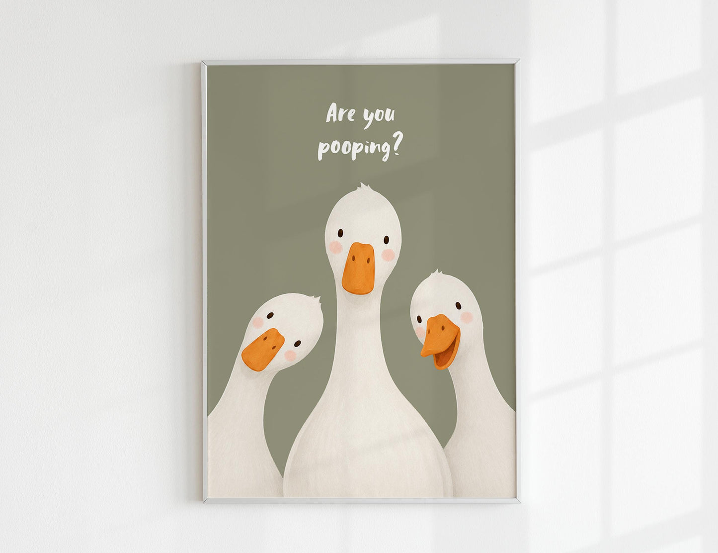 Are You Pooping print, funny bathroom wall art featuring three cute white geese with orange beaks and rosy cheeks on a soft coloured background, whimsical illustrated toilet humour poster also loved as duck art and silly goose art, available in 11 colours including pink jade olive yellow forest green blue sky blonde blue dusk grey claret indigo and white, perfect housewarming gift for powder rooms guest bathrooms and quirky interiors, printed on premium 260gsm satin lustre paper