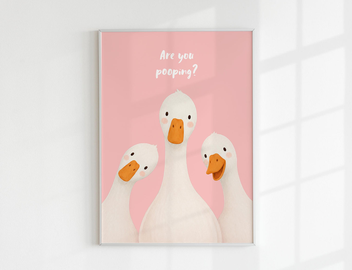 Are You Pooping print, funny bathroom wall art featuring three cute white geese with orange beaks and rosy cheeks on a soft coloured background, whimsical illustrated toilet humour poster also loved as duck art and silly goose art, available in 11 colours including pink jade olive yellow forest green blue sky blonde blue dusk grey claret indigo and white, perfect housewarming gift for powder rooms guest bathrooms and quirky interiors, printed on premium 260gsm satin lustre paper