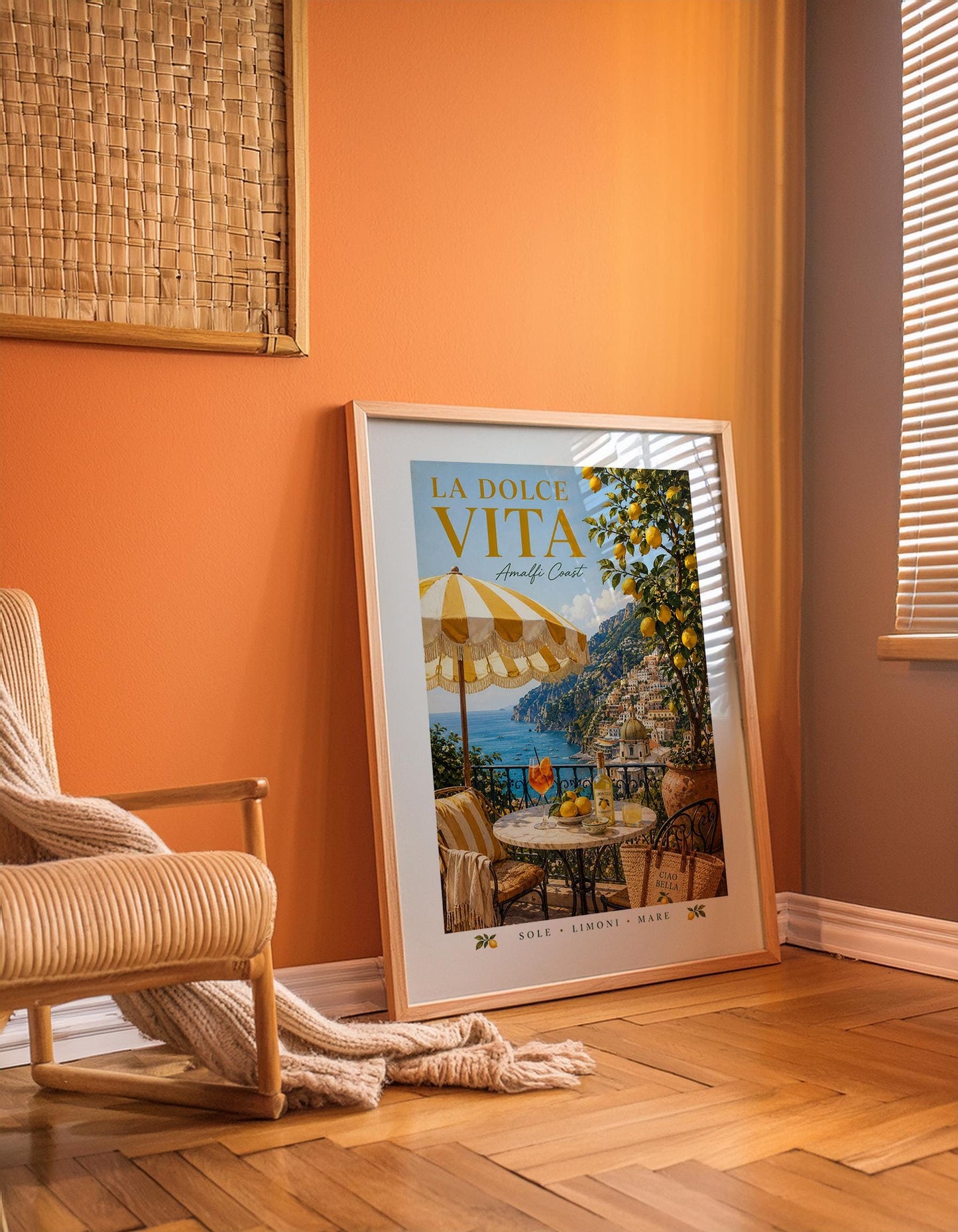 La Dolce Vita Amalfi Coast poster featuring a sunny Italian balcony with yellow and white striped umbrella, marble bistro table with Aperol spritz and Limoncello, lemon tree and view of Positano coastline, vintage Italian travel poster style wall art in warm golden palette, perfect Mediterranean print for kitchens dining rooms and Italy lovers, printed on premium 260gsm satin lustre paper, handmade in the UK by Hues and Reflections small business