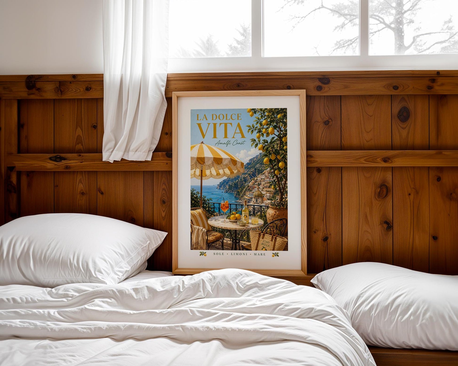 La Dolce Vita Amalfi Coast poster featuring a sunny Italian balcony with yellow and white striped umbrella, marble bistro table with Aperol spritz and Limoncello, lemon tree and view of Positano coastline, vintage Italian travel poster style wall art in warm golden palette, perfect Mediterranean print for kitchens dining rooms and Italy lovers, printed on premium 260gsm satin lustre paper, handmade in the UK by Hues and Reflections small business