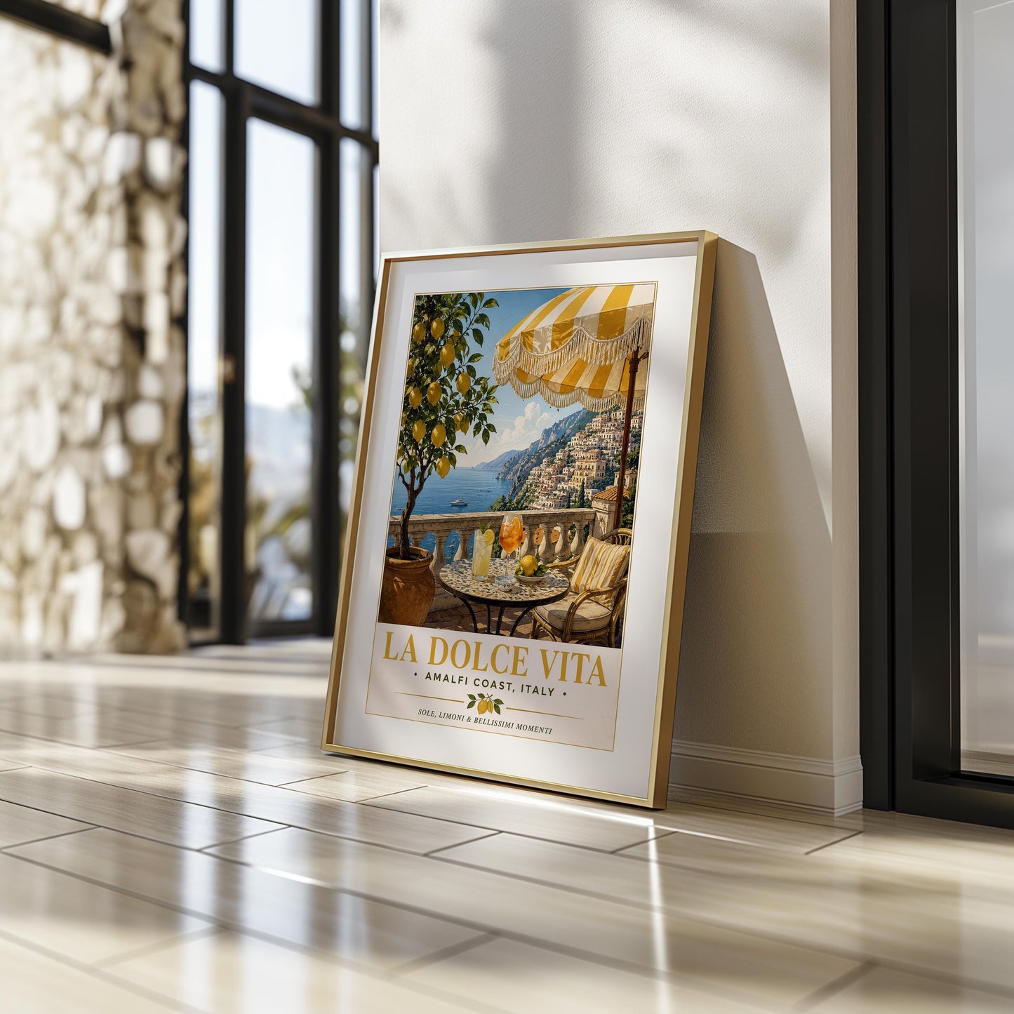 La Dolce Vita vintage travel poster of the Amalfi Coast featuring a Positano terrace with fringed yellow striped umbrella, terrazzo bistro table with Aperol spritz and limoncello, lemon tree in terracotta pot and sweeping view of the Italian coastline, classic Italian railway poster style wall art with golden typography, perfect Mediterranean print for kitchens dining rooms and Italy lovers, printed on premium 260gsm satin lustre paper, handmade in the UK by Hues and Reflections small business