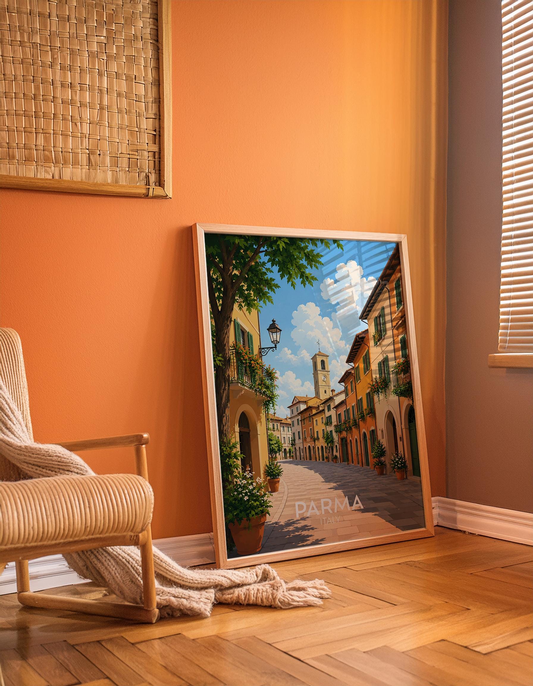 Parma Italy travel poster featuring a sun-drenched cobbled street lined with warm ochre and terracotta buildings, green wooden shutters, flower-filled balconies and a bell tower against a blue summer sky, vintage Italian travel poster style wall art capturing the charm of Emilia Romagna, perfect Italy print for kitchens dining rooms food lovers and anyone with memories of Parma, printed on premium 260gsm satin lustre paper, handmade in the UK by Hues and Reflections small business