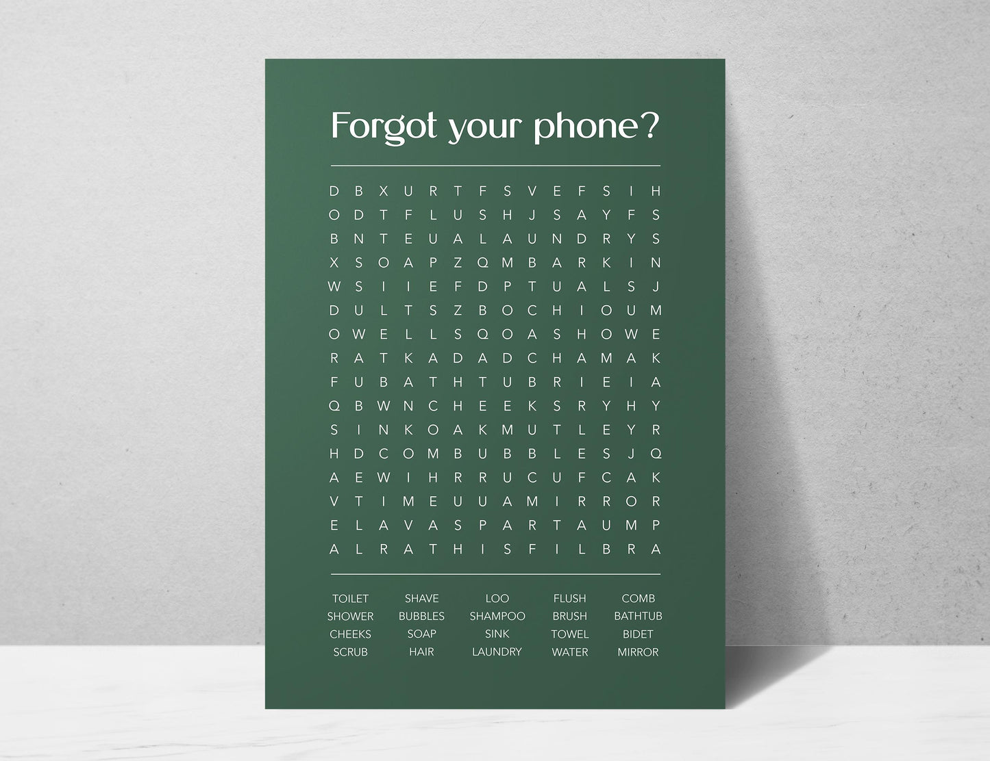 Funny bathroom word search print with the title Forgot Your Phone, modern typographic puzzle wall art featuring hidden bathroom themed words including shower bubbles bidet flush and comb, quirky toilet humour poster available in 8 colours including beige black and white blonde claret forest indigo lobster and olive, perfect for guest bathrooms powder rooms and as a housewarming gift, printed on premium 260gsm satin lustre paper, handmade in the UK by Hues and Reflections small business