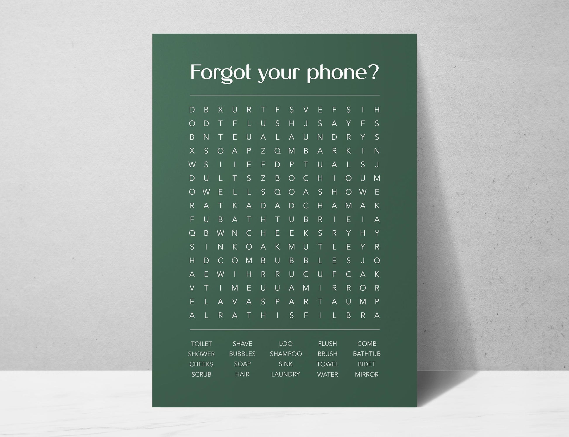 Funny bathroom word search print with the title Forgot Your Phone, modern typographic puzzle wall art featuring hidden bathroom themed words including shower bubbles bidet flush and comb, quirky toilet humour poster available in 8 colours including beige black and white blonde claret forest indigo lobster and olive, perfect for guest bathrooms powder rooms and as a housewarming gift, printed on premium 260gsm satin lustre paper, handmade in the UK by Hues and Reflections small business