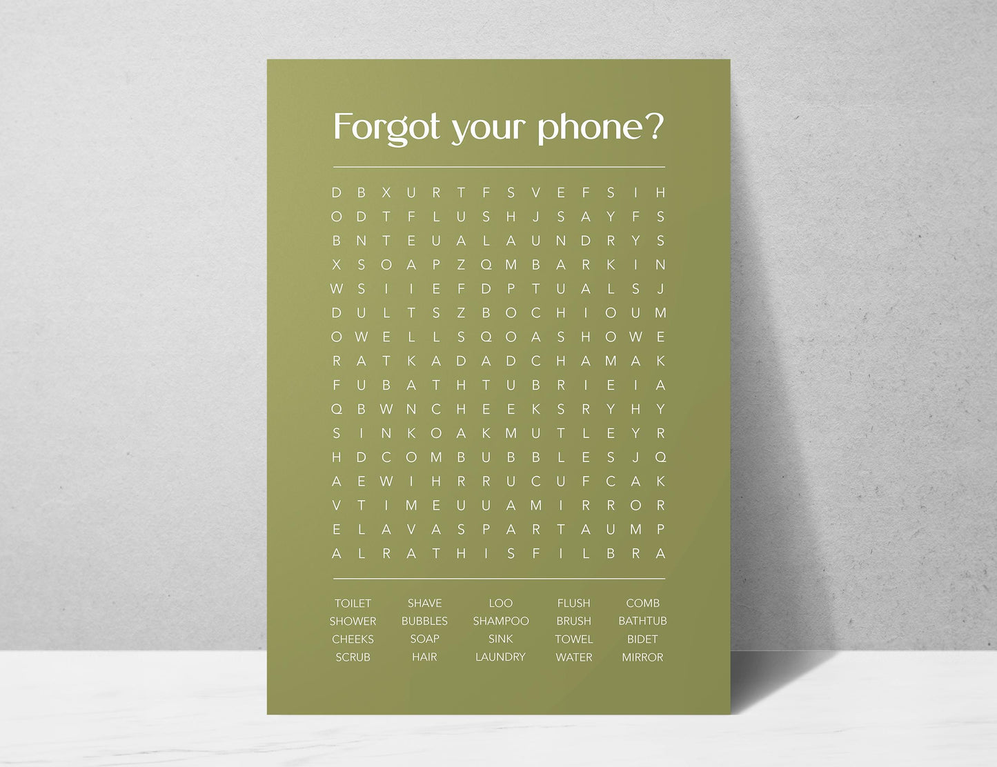 Funny bathroom word search print with the title Forgot Your Phone, modern typographic puzzle wall art featuring hidden bathroom themed words including shower bubbles bidet flush and comb, quirky toilet humour poster available in 8 colours including beige black and white blonde claret forest indigo lobster and olive, perfect for guest bathrooms powder rooms and as a housewarming gift, printed on premium 260gsm satin lustre paper, handmade in the UK by Hues and Reflections small business