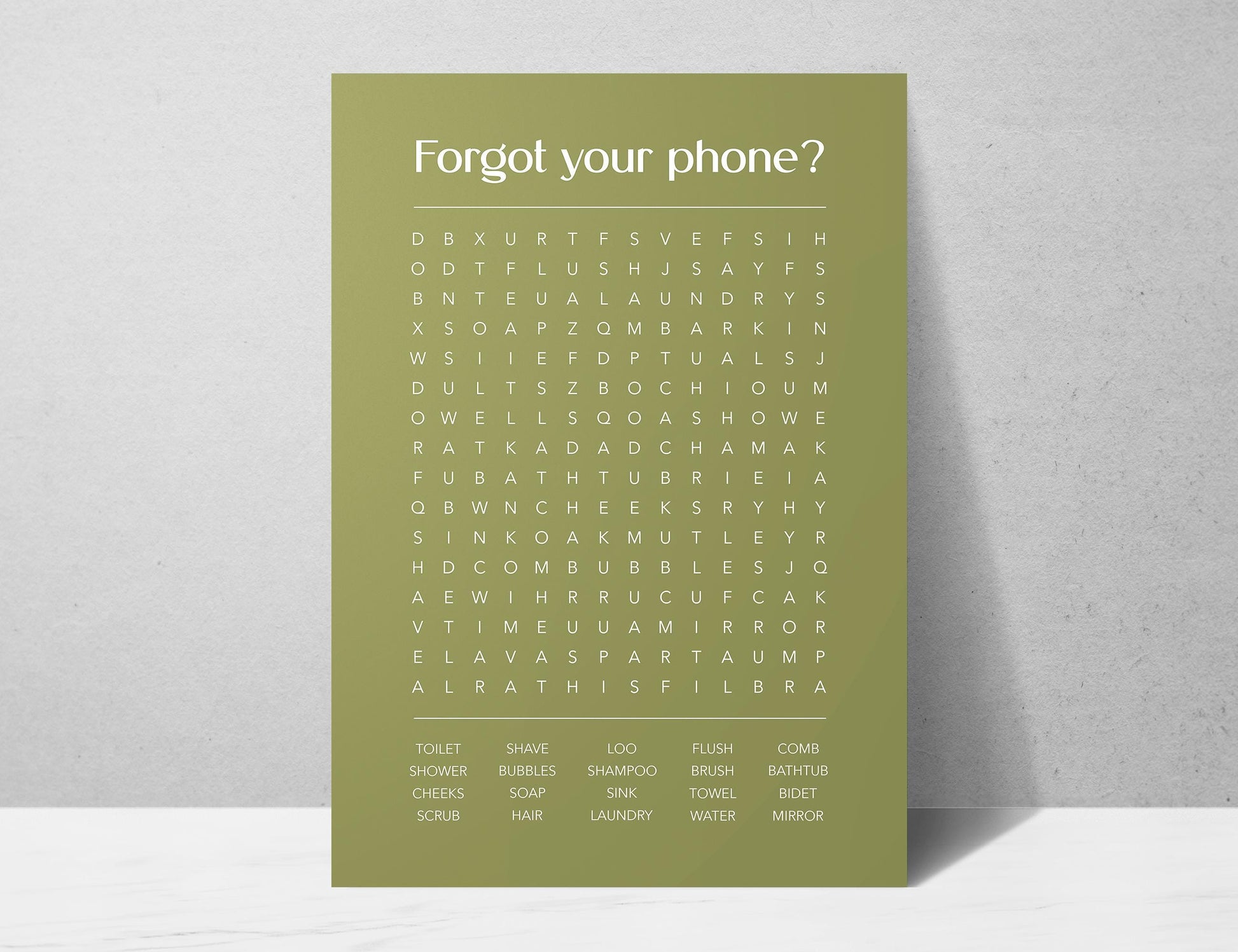 Funny bathroom word search print with the title Forgot Your Phone, modern typographic puzzle wall art featuring hidden bathroom themed words including shower bubbles bidet flush and comb, quirky toilet humour poster available in 8 colours including beige black and white blonde claret forest indigo lobster and olive, perfect for guest bathrooms powder rooms and as a housewarming gift, printed on premium 260gsm satin lustre paper, handmade in the UK by Hues and Reflections small business