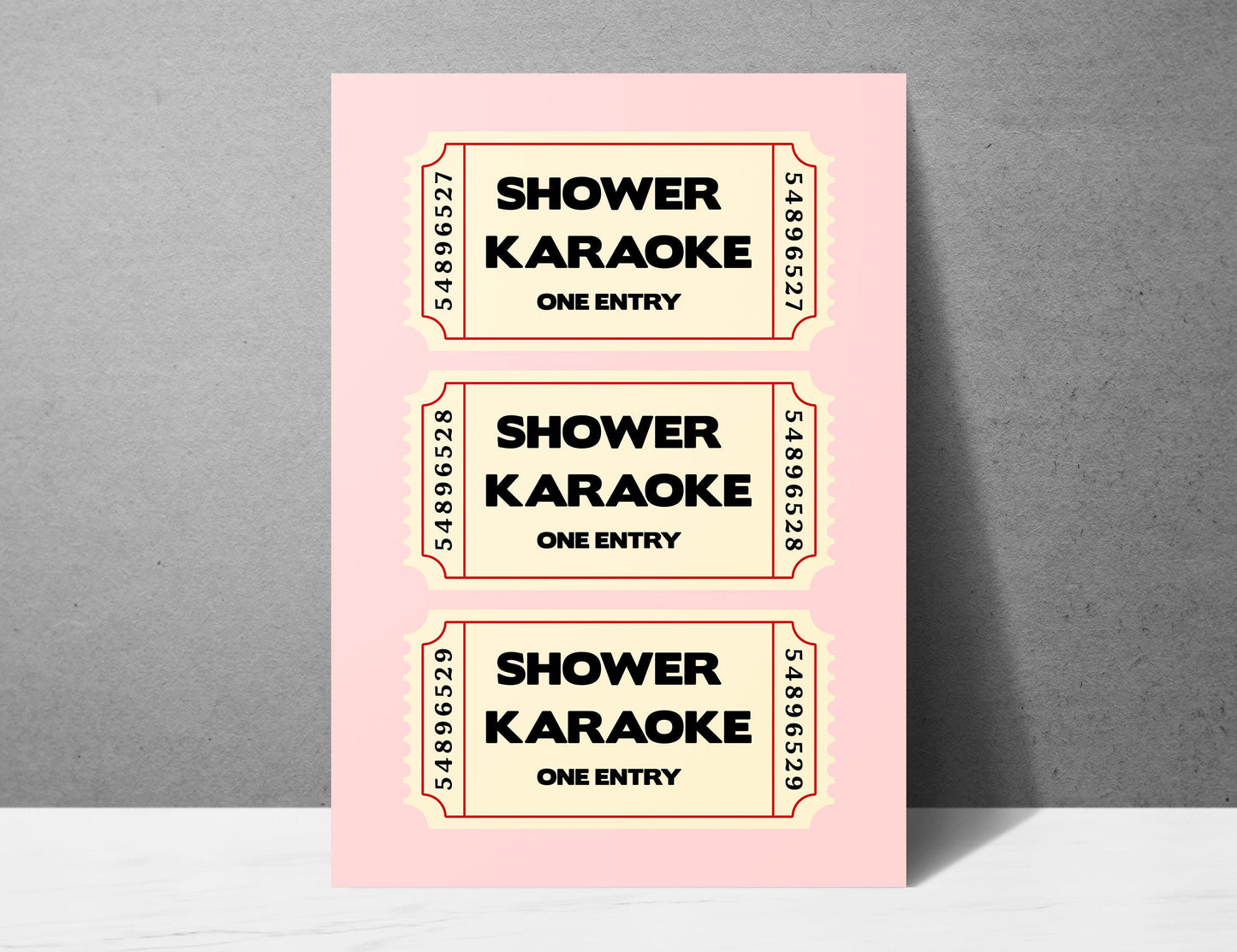 Shower Karaoke ticket print, funny pink bathroom wall art featuring a stack of three retro vintage style cream tickets with bold black typography reading Shower Karaoke One Entry on a soft blush pink background, trendy aesthetic poster for main bathrooms en-suites guest powder rooms and teen bathrooms, perfect housewarming and hen do gift for shower singers everywhere, printed on premium 260gsm satin lustre paper, handmade in the UK by Hues and Reflections small business