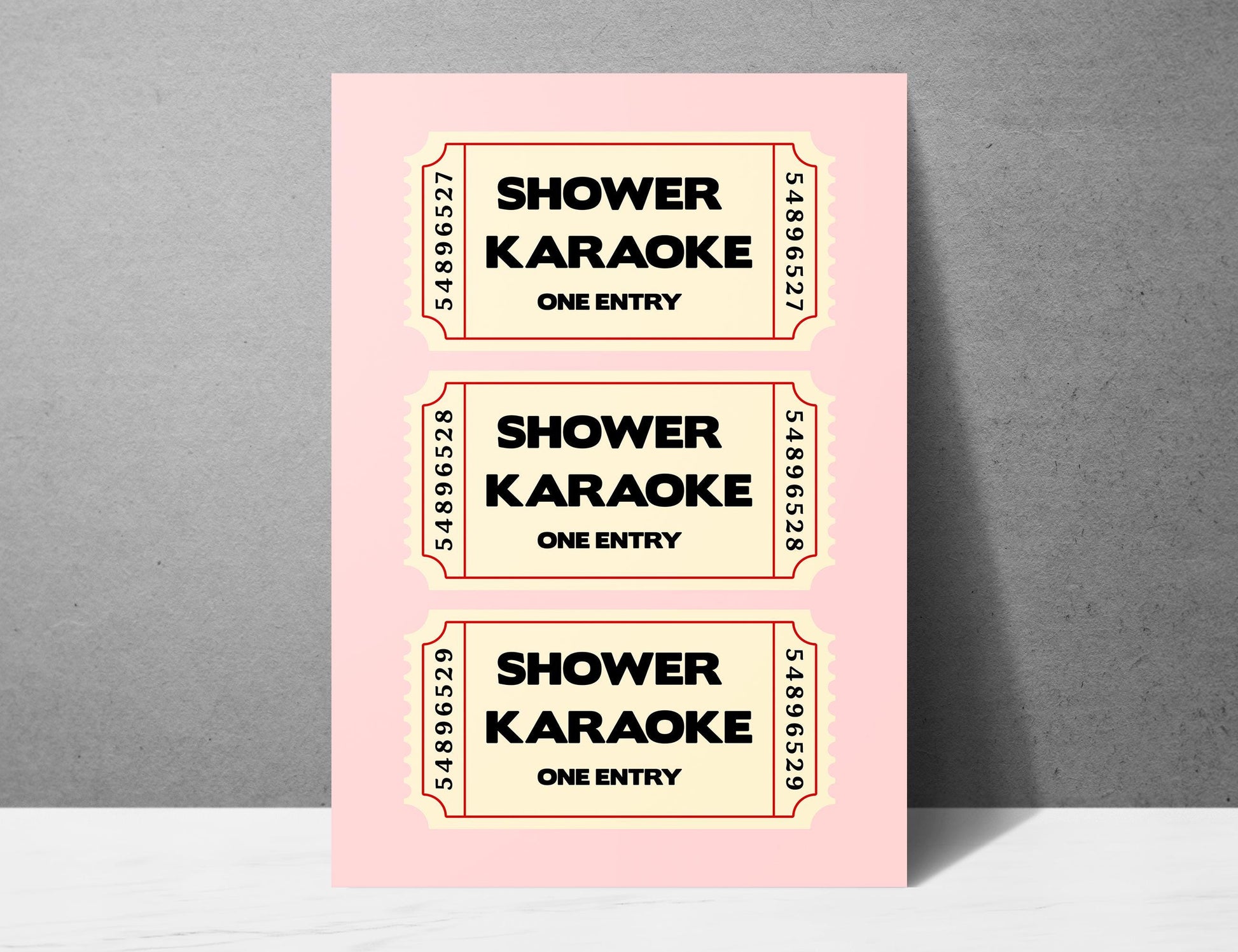 Shower Karaoke ticket print, funny pink bathroom wall art featuring a stack of three retro vintage style cream tickets with bold black typography reading Shower Karaoke One Entry on a soft blush pink background, trendy aesthetic poster for main bathrooms en-suites guest powder rooms and teen bathrooms, perfect housewarming and hen do gift for shower singers everywhere, printed on premium 260gsm satin lustre paper, handmade in the UK by Hues and Reflections small business