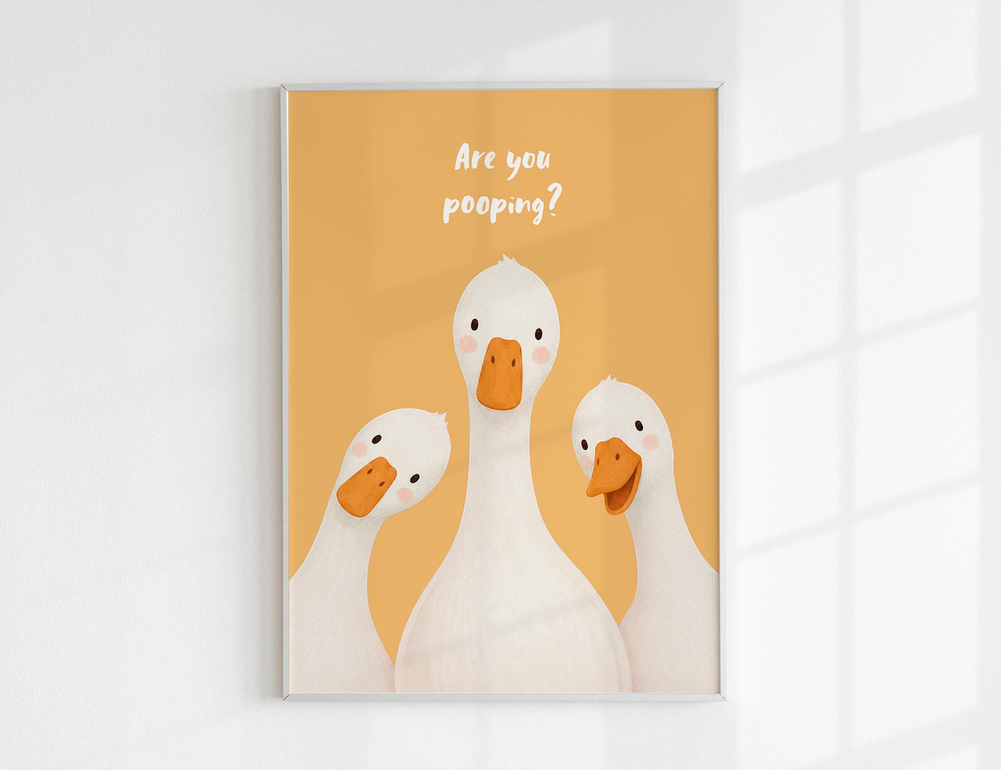 Are You Pooping print, funny bathroom wall art featuring three cute white geese with orange beaks and rosy cheeks on a soft coloured background, whimsical illustrated toilet humour poster also loved as duck art and silly goose art, available in 11 colours including pink jade olive yellow forest green blue sky blonde blue dusk grey claret indigo and white, perfect housewarming gift for powder rooms guest bathrooms and quirky interiors, printed on premium 260gsm satin lustre paper